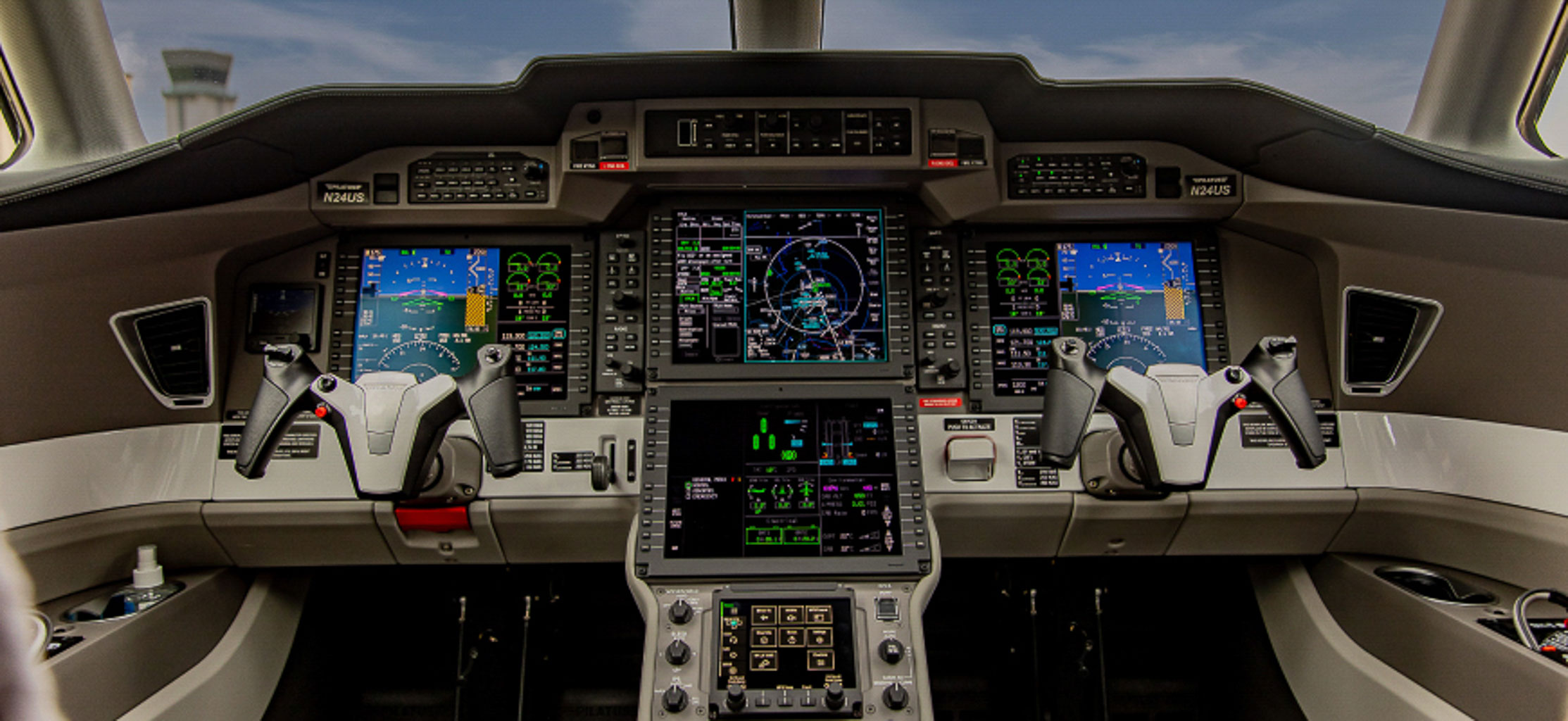 An interior view of a jet cockpit and instrument panel
